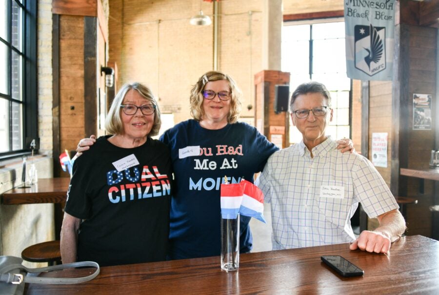 three dual citizens in a brewery