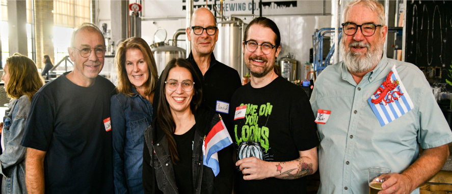 Smiling dual Luxembourg citizens in a US brewery