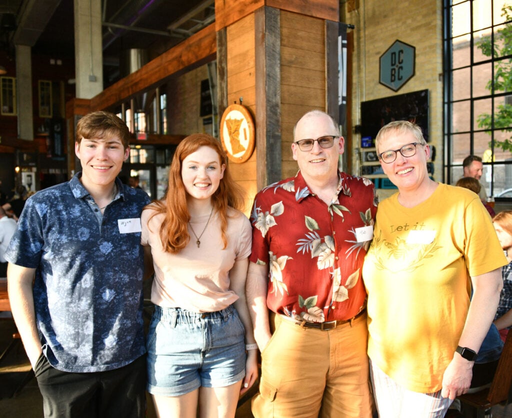 Four people posing for a photo